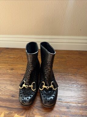 Black Perforated Leather Ankle Boots with Gold Hardware